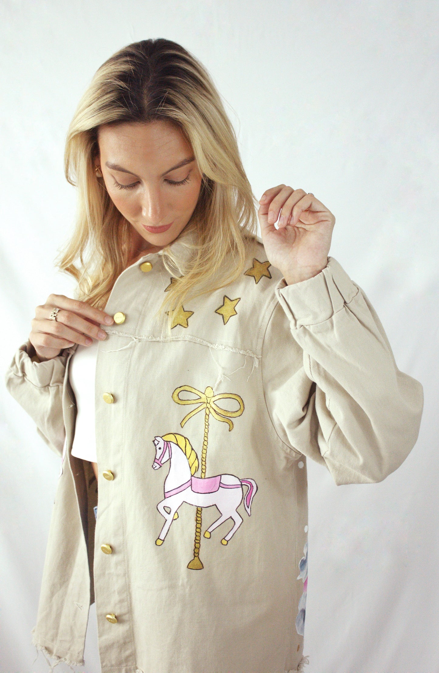 Hand-painted oversized gabardine jacket with carousel horse design in pink, gold, and white for women