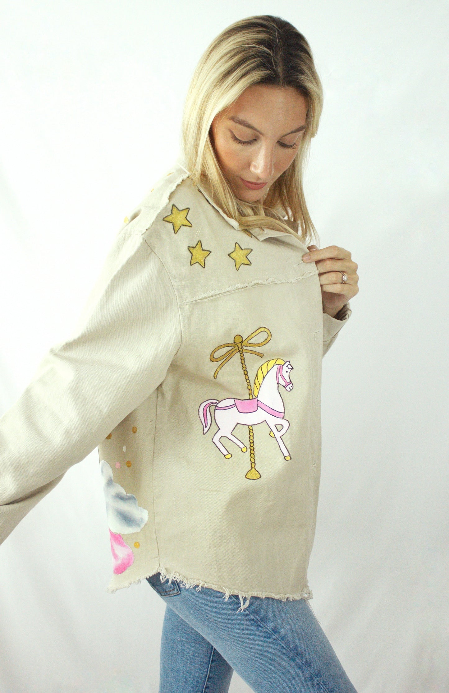 Hand-painted oversized gabardine jacket with carousel horse design in pink, gold, and white for women