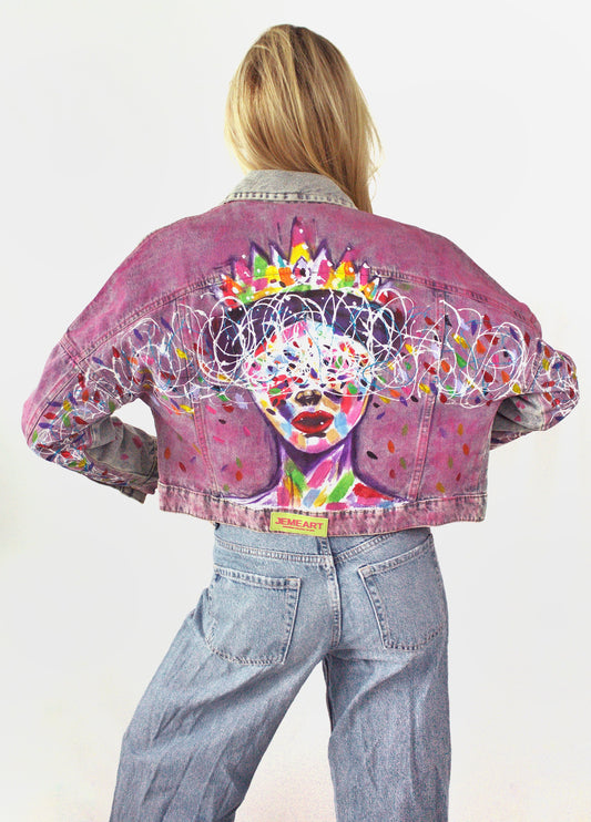 Unique painted denim jacket showcasing colorful details and an intuition-inspired artistic design.